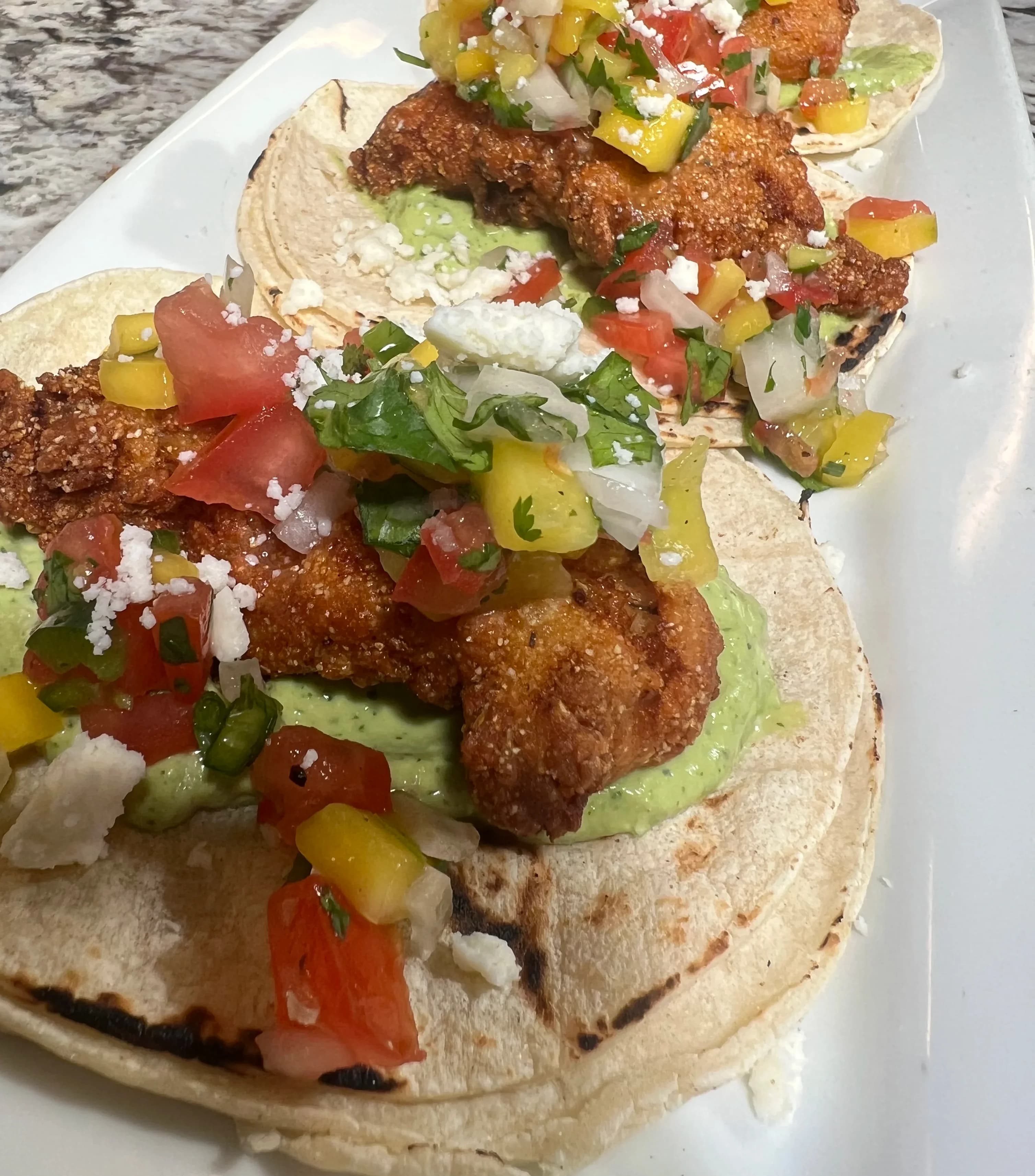 Picture of Fish Tacos - Mango Salsa - Salsa de Aguacate